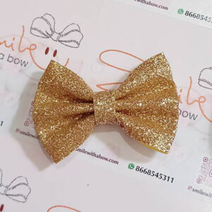 Gold star glitter bow